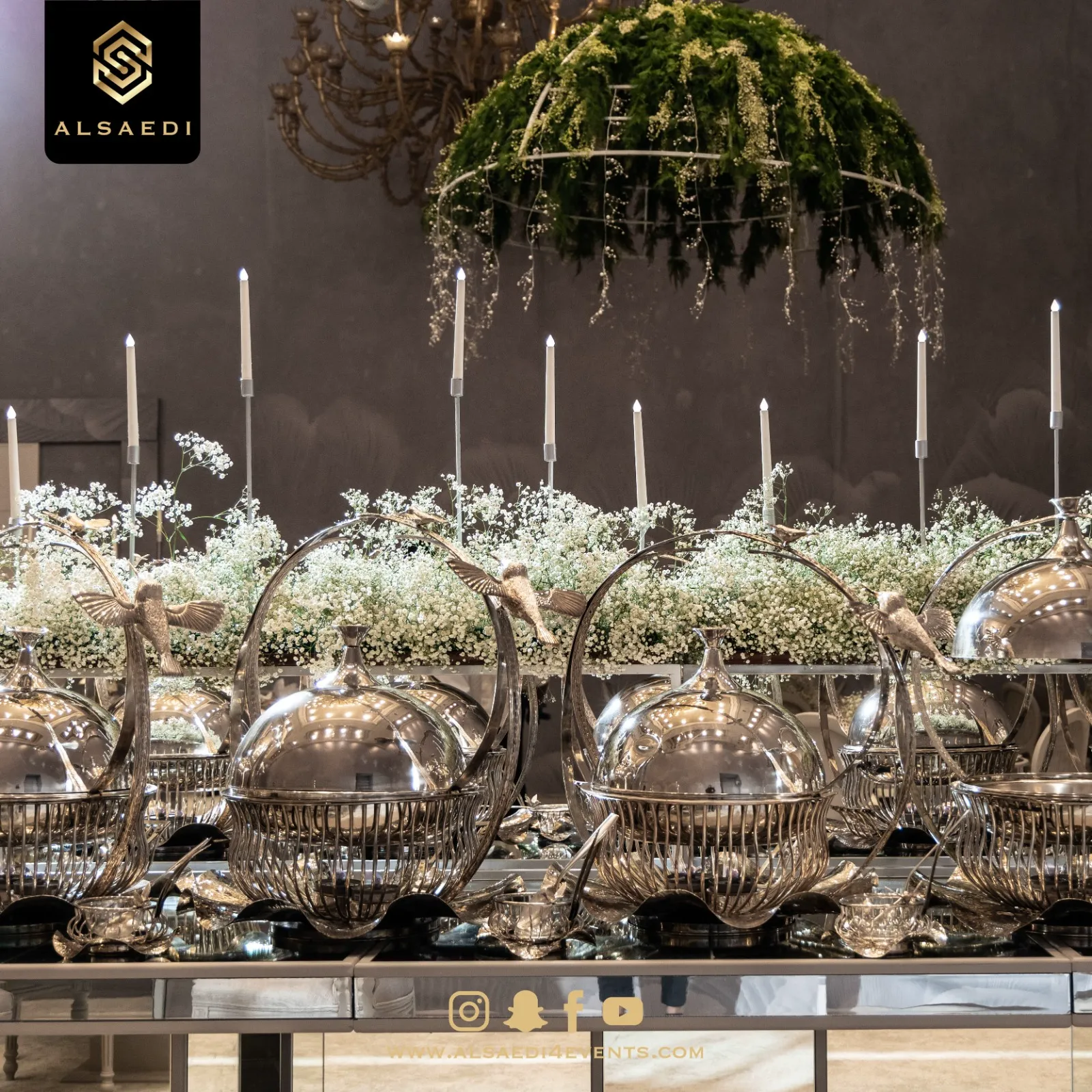 Silver buffet with candelabra and floral canopy