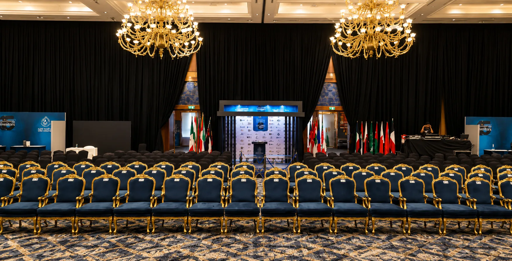 Formal conference stage with flags